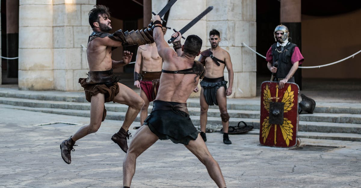 Intense scene of gladiators engaging in combat with swords in an ancient-style arena.