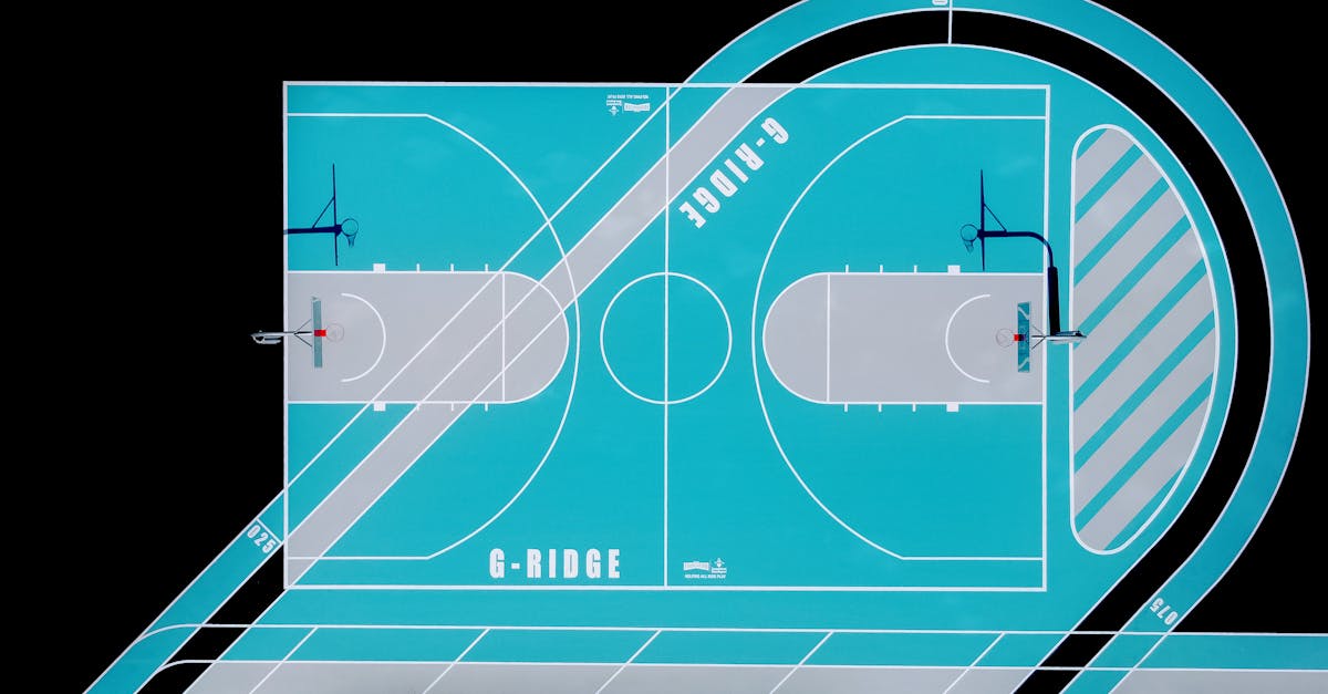 Top-view photo showcasing a vibrant blue and gray modern basketball court layout. gambar ukuran lapangan bola basket