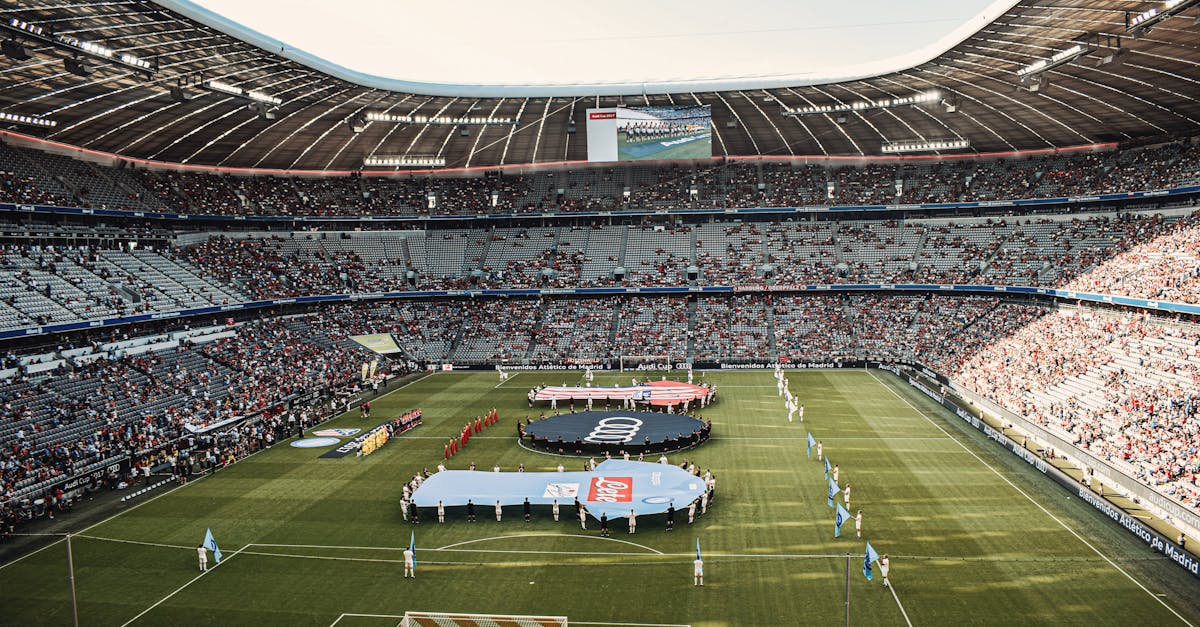 Captivating view of a soccer match at Munich's iconic Allianz Arena, filled with excited fans.